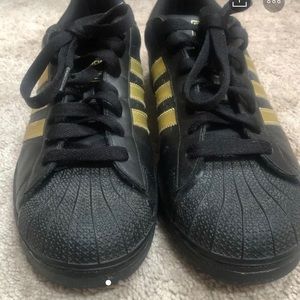 Adidas black and gold shell tops